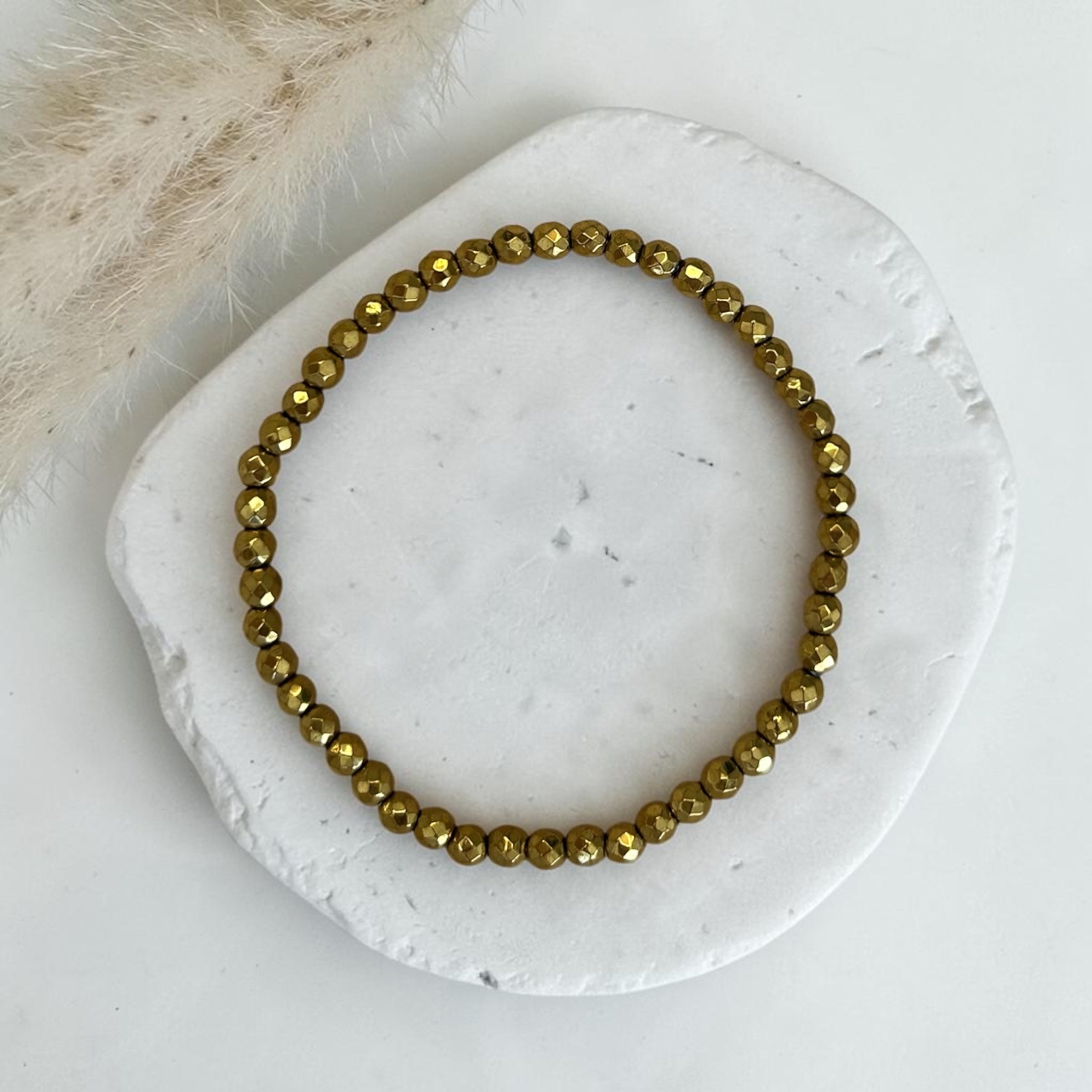 Hämatit Armband gold faccetiert